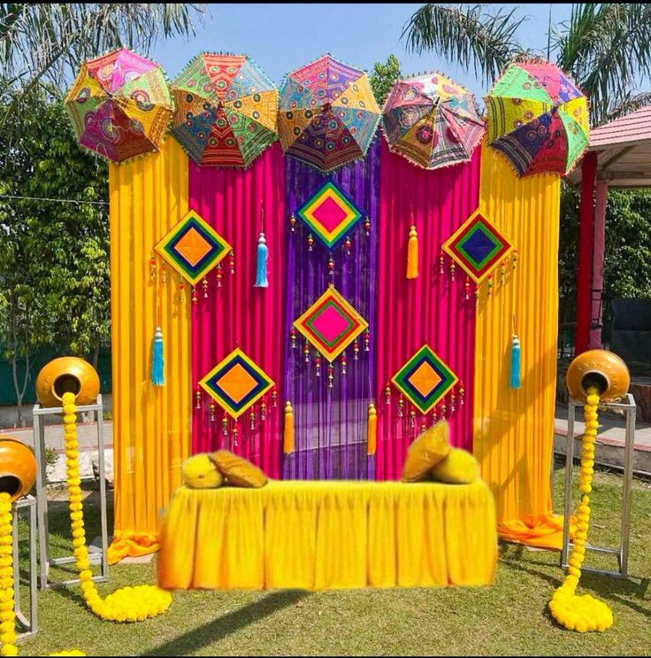 Colourful umbrella mehendi stage setup